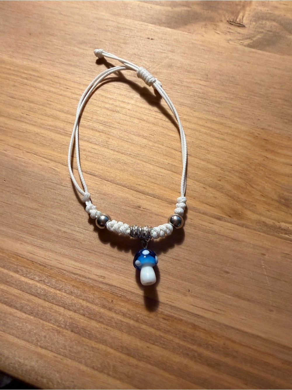 Adjustable White Cord Bracelet with Blue Mushroom Charm